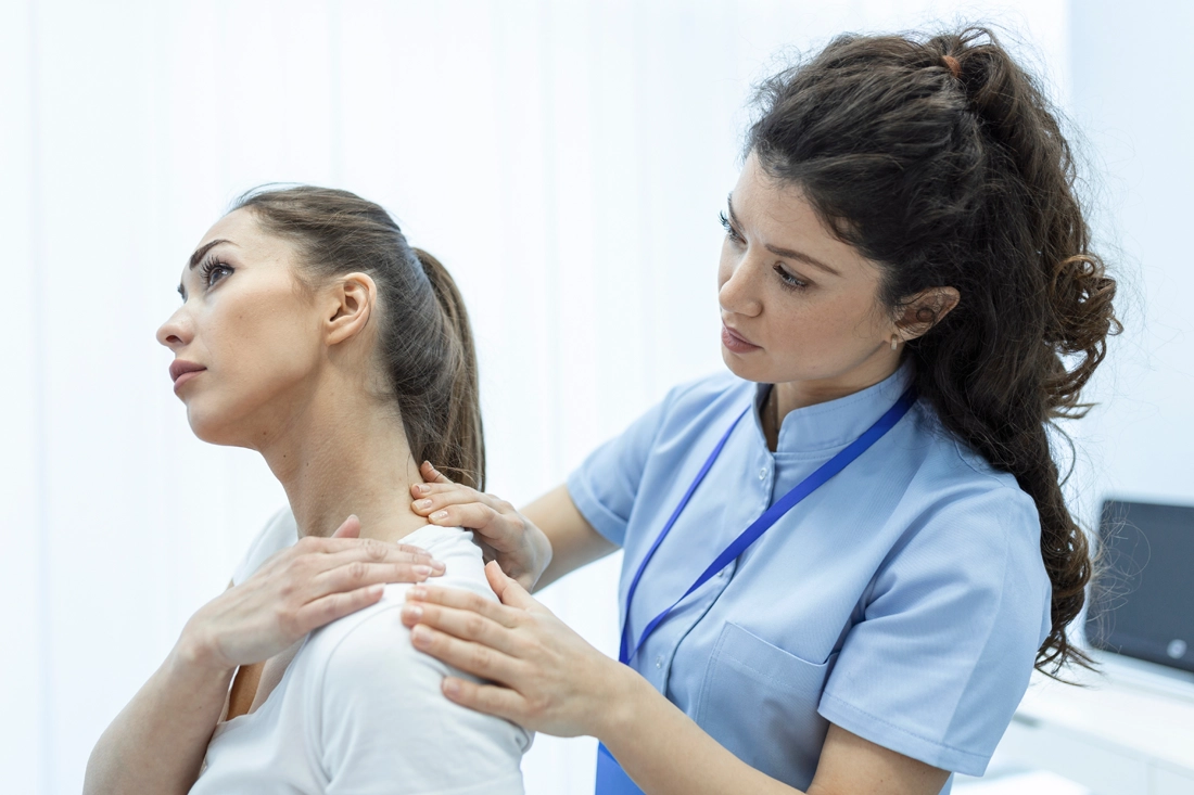 Healthcare provider assessing neck and shoulder pain for a patient participating in chronic pain clinical trials at Equity Medical in NY and KY