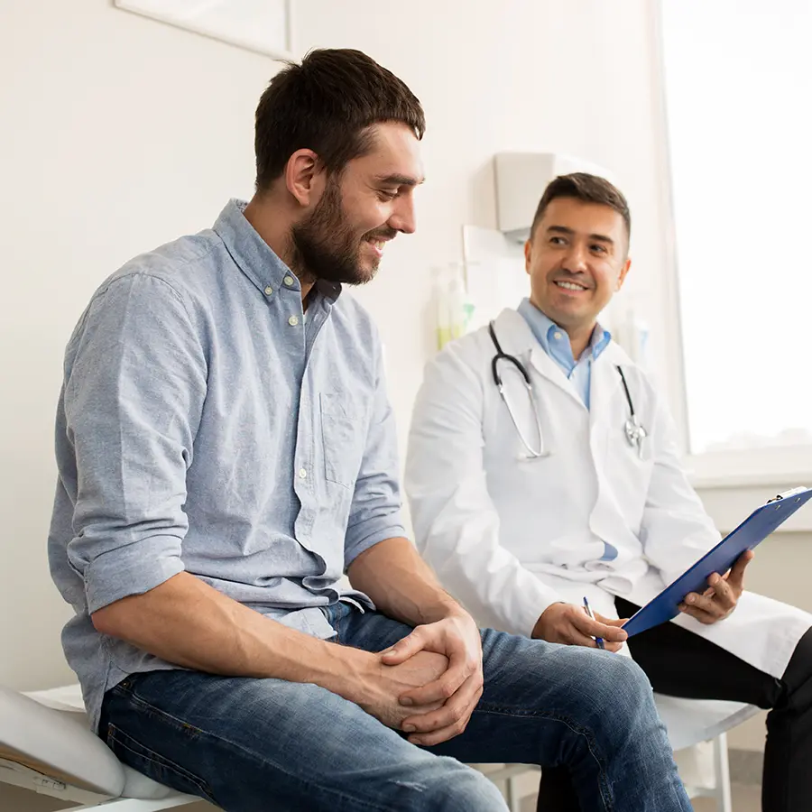 Friendly doctor meeting with patient in a supportive environment, representing insomnia clinical trials and nationwide access through Equity Medical