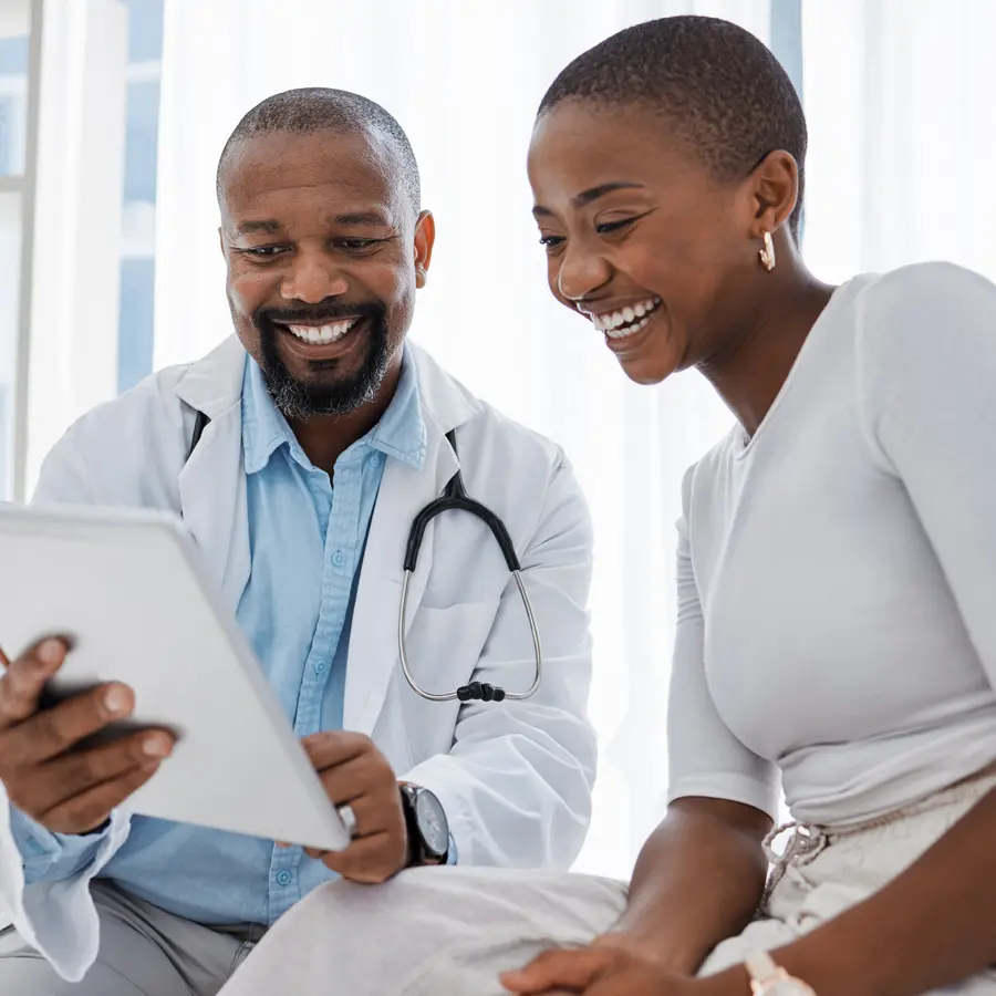 Doctor reviewing information with patient during consultation for lupus clinical trials, representing nationwide access through Equity Medical