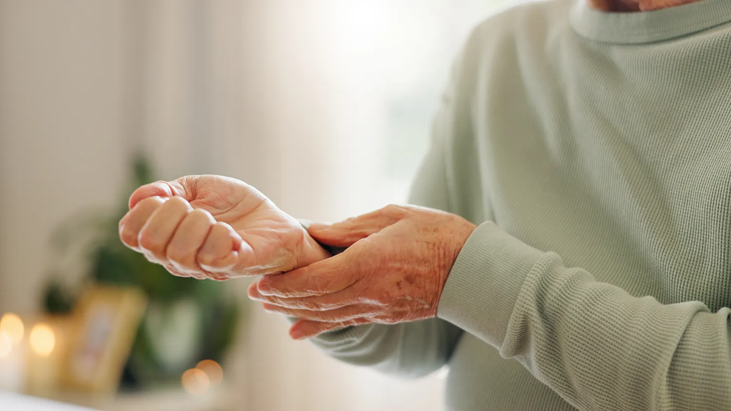 Person experiencing wrist and hand pain related to psoriatic arthritis symptoms for clinical trials at Equity Medical nationwide
