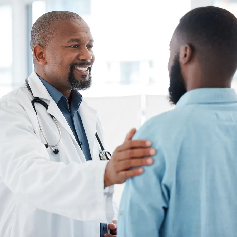 Doctor speaking with patient about participating in rheumatoid arthritis clinical trials