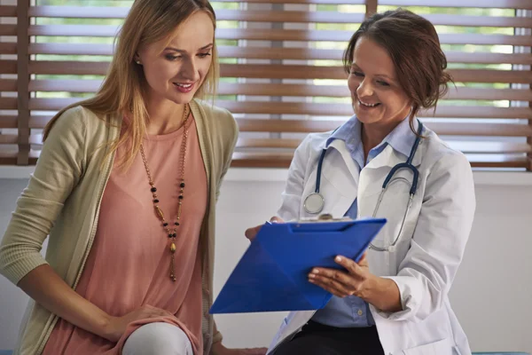 Patient reviewing women’s health clinical trials for bacterial vaginosis with a provider at Equity Medical.