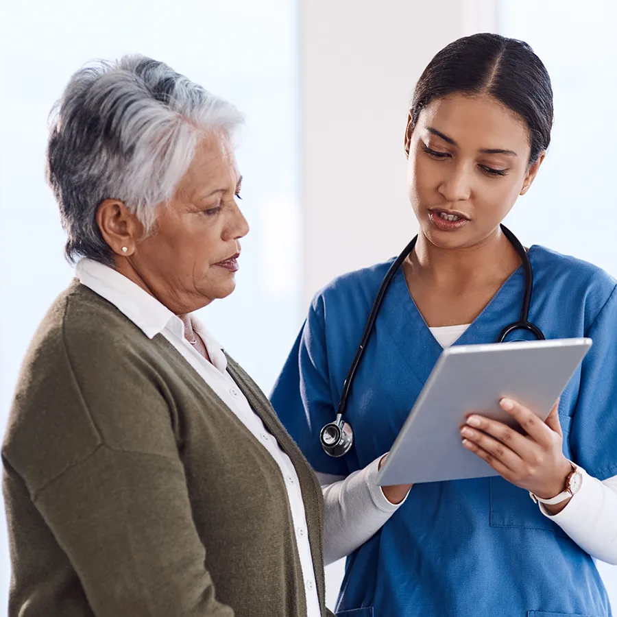 Older adult patient discussing macular degeneration clinical trials with a healthcare provider through Equity Medical’s nationwide research network.