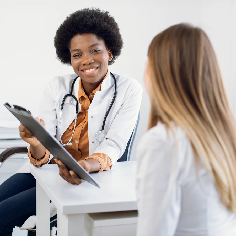 Physician reviewing endometriosis research participation information with a potential clinical trial participant at Equity Medical.