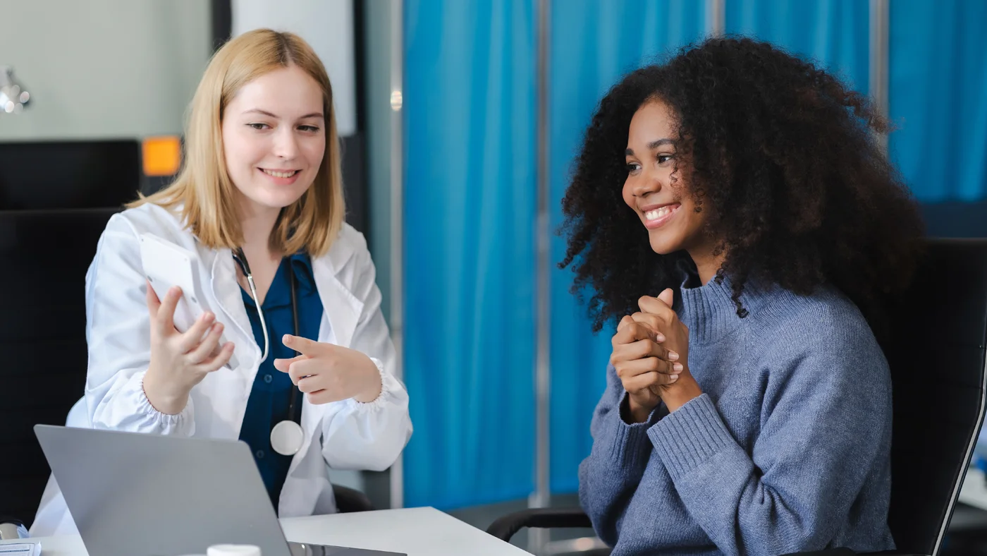 Physician reviewing bacterial vaginosis clinical trial information with a participant at Equity Medical during a research consultation available nationwide.