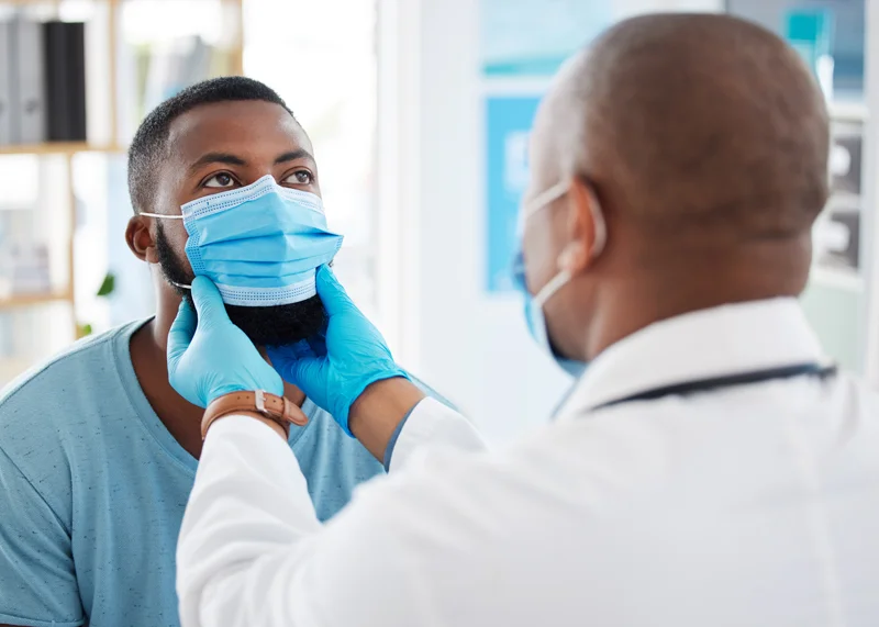 Doctor examining a patient during a clinical trials visit at Equity Medical in Nashville, TN