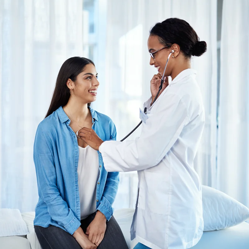 Doctor conducting a clinical assessment with a participant at an Equity Medical clinical trials research center.