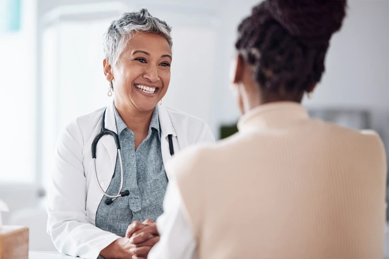 Doctor consulting with a woman at Equity Medical’s Owensboro, KY clinical research location.