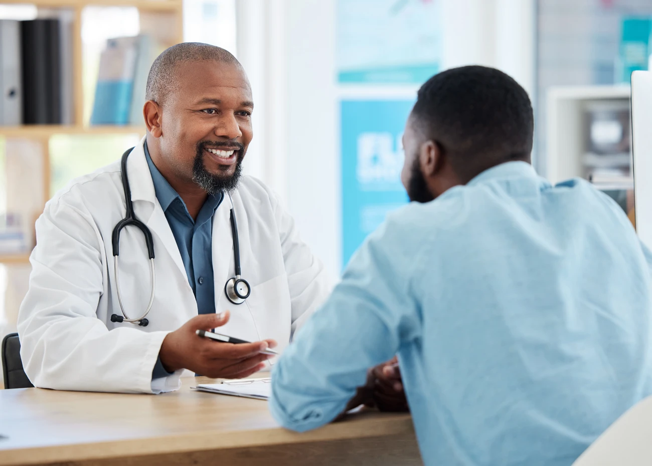 Equity Medical provider speaking with a patient about clinical study referral opportunities