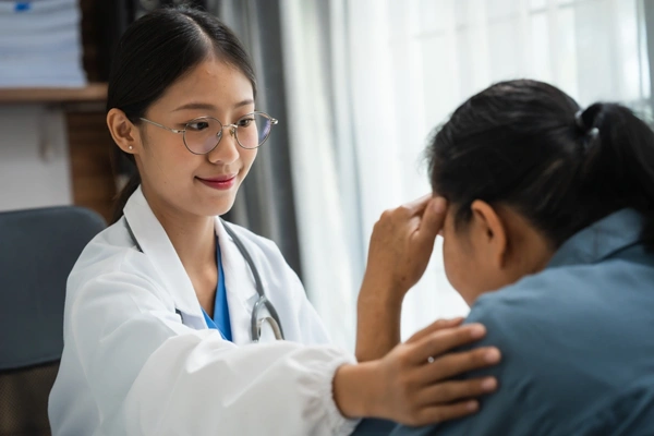 Physician supporting a patient through care and research at the Equity Medical Women’s Health Center of Excellence in Owensboro, KY.