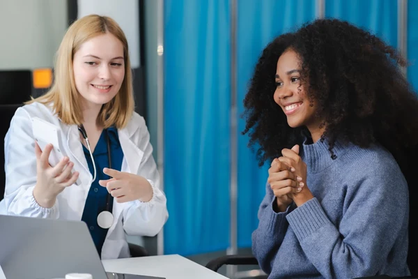 Doctor discussing women’s health clinical trials with a patient at Equity Medical in Owensboro, KY.